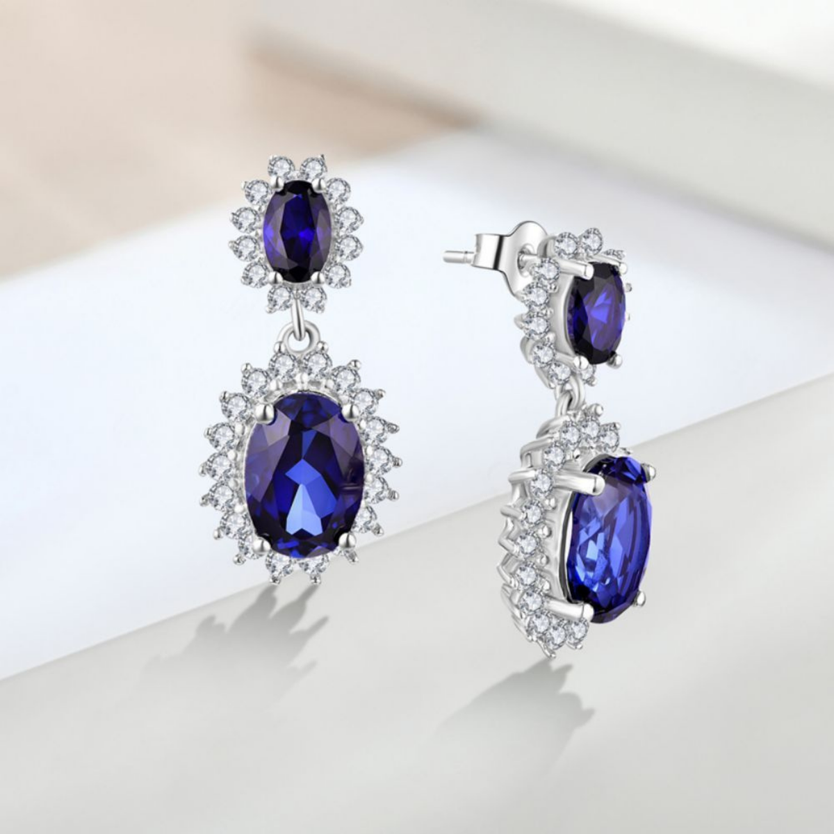Oval Blue Zircon Drop Earrings with Halo Setting — view 2