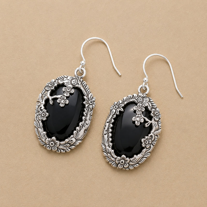 Oval Black Glass Drop Earrings with Floral Frame Detail — main image