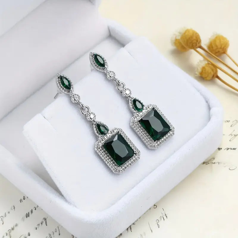Emerald-Cut Green Stone Dangle Earrings with Silver-Tone Halo Accents