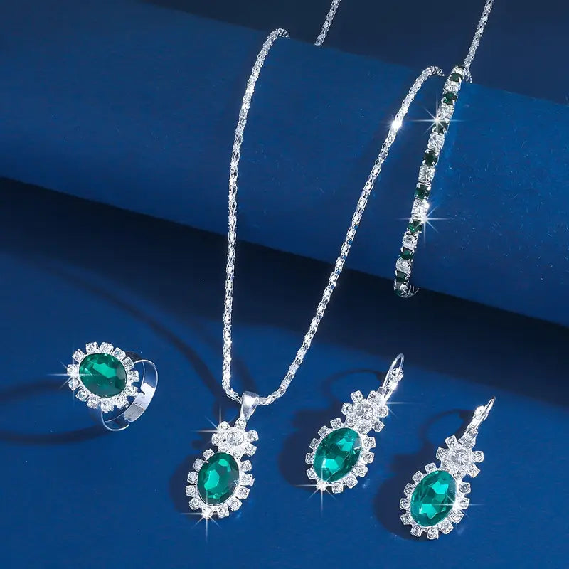 Oval Emerald Halo Jewelry Set with Necklace, Earrings, Bracelet & Ring