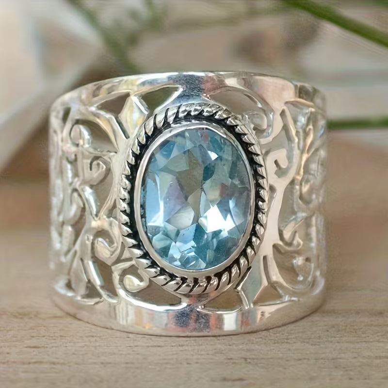 Oval Light Blue Cubic Zirconia Ring with Scrollwork Band