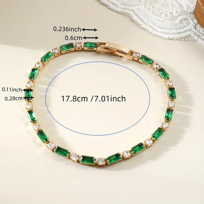 Emerald Tennis Bracelet with Round Accent Stones in Gold Tone