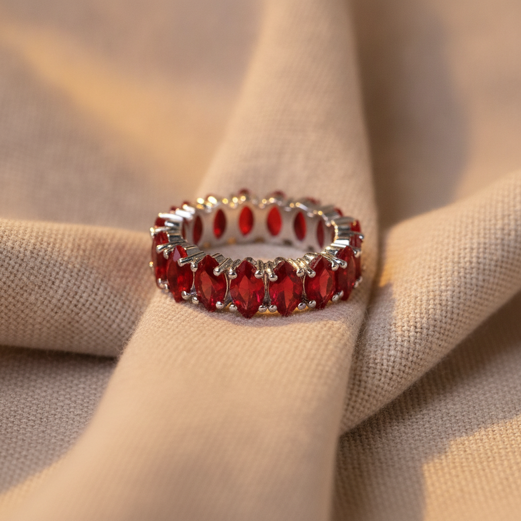 gold ring with red crystal inlays — studio
