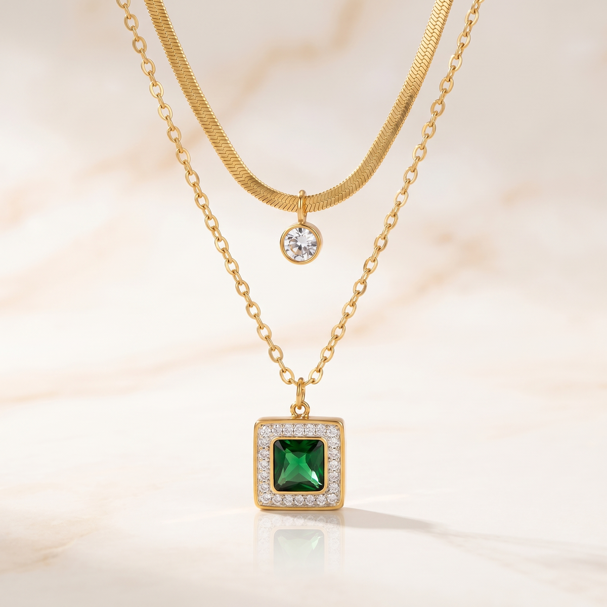 Layered Necklace with Square Emerald-Green Stone and Round Clear Stone Pendants in Gold Tone — main image