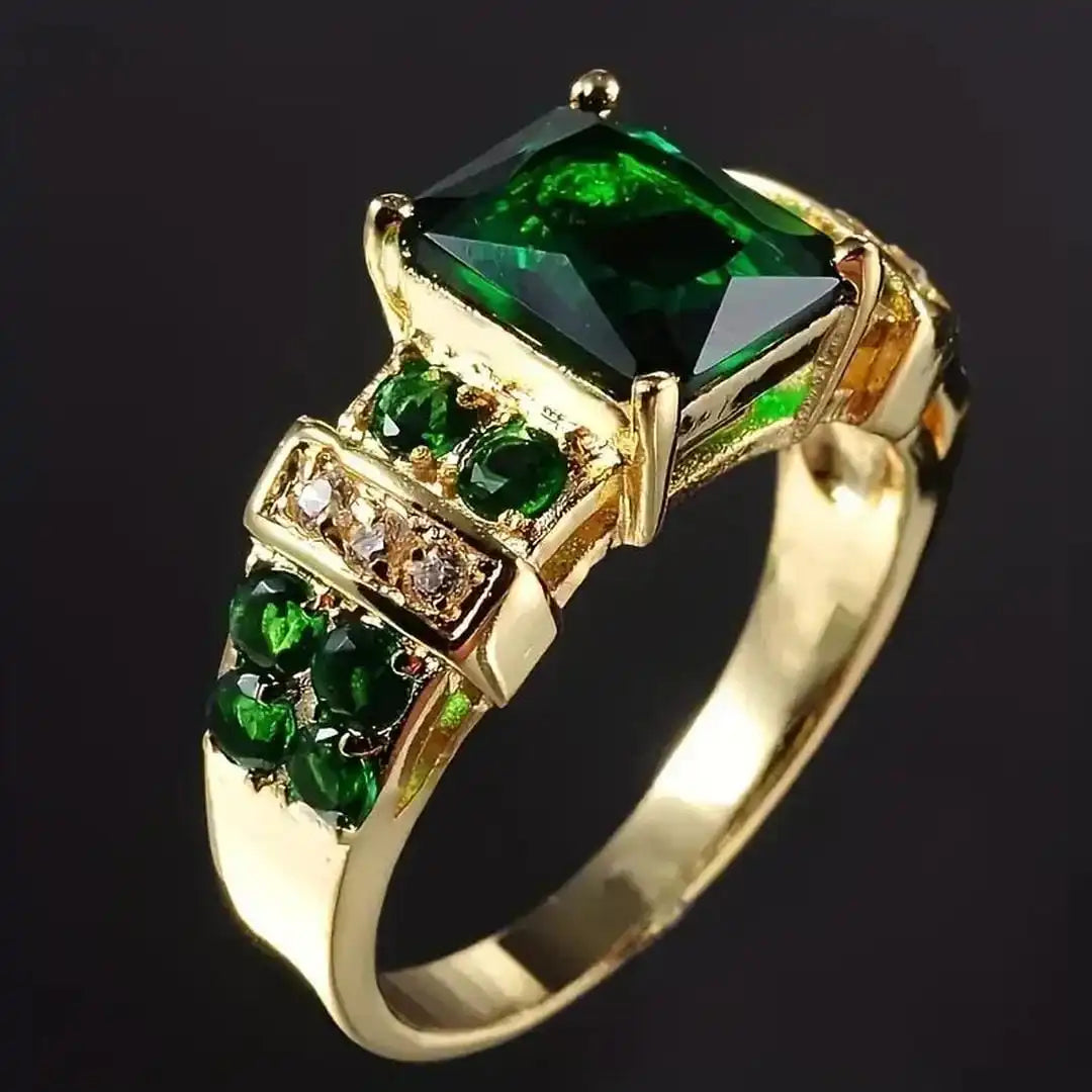 Emerald-Cut Emerald Ring with Tiered Gold-Tone Setting and Accent Stones