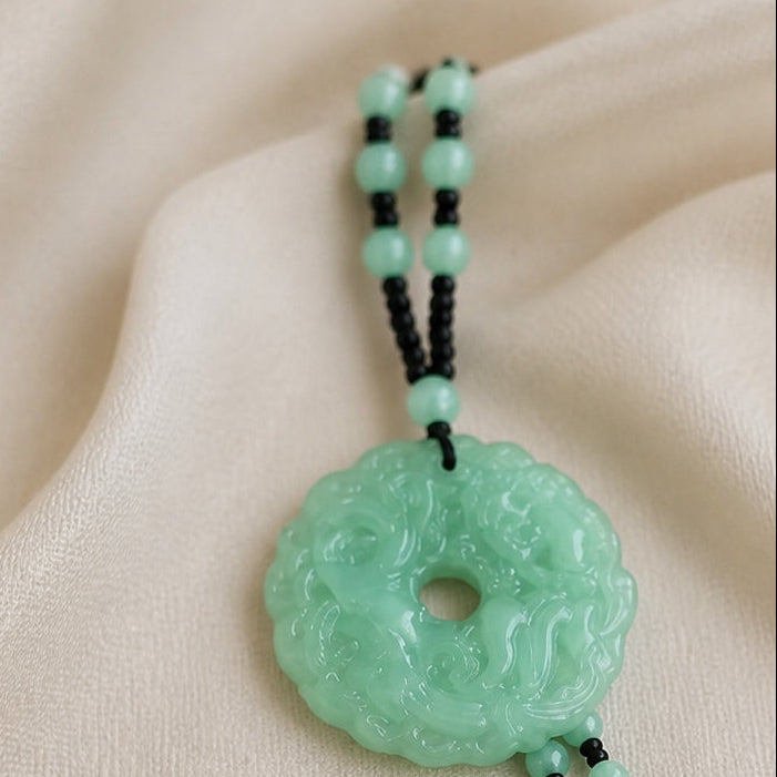 Carved Jade Donut Pendant Necklace with Black Beaded Cord — view 2