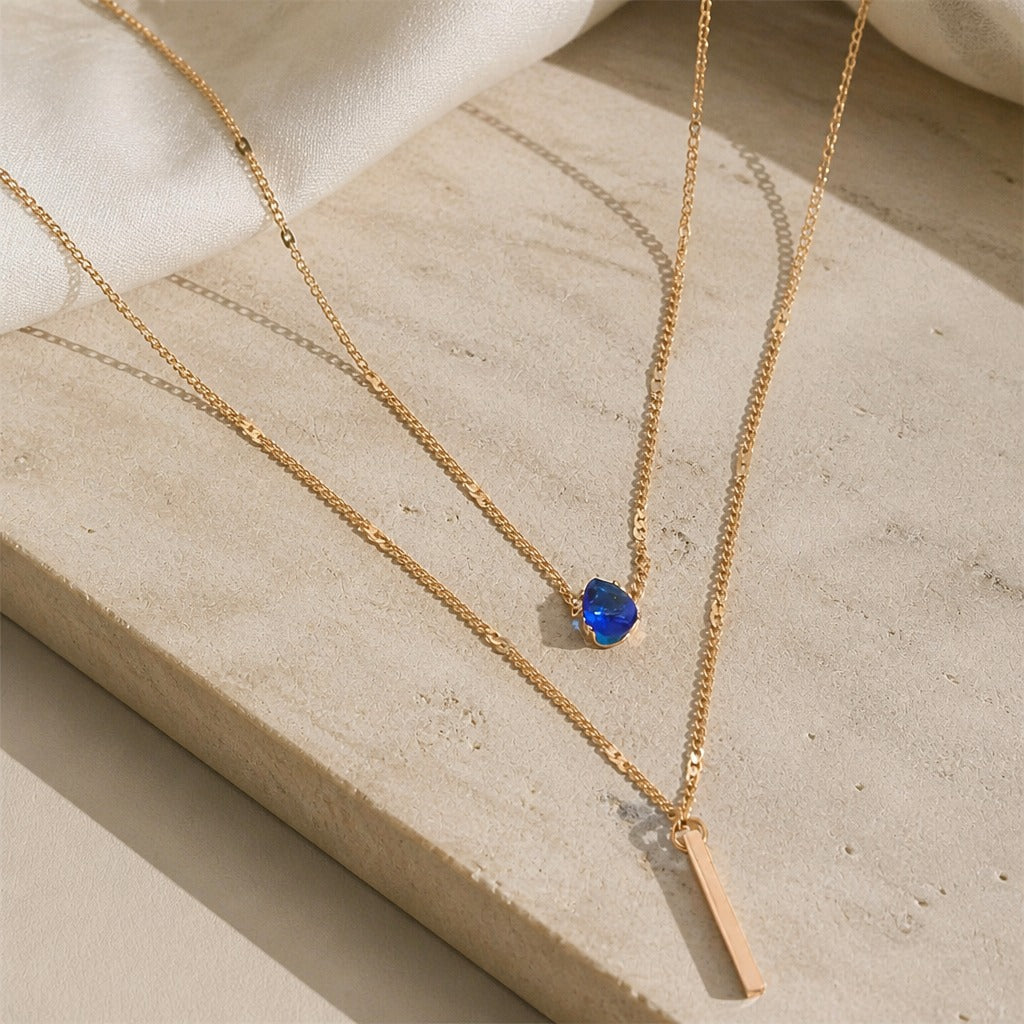Teardrop Sapphire Blue Two-Strand Layered Necklace with Gold-Tone Bar Charm — main image