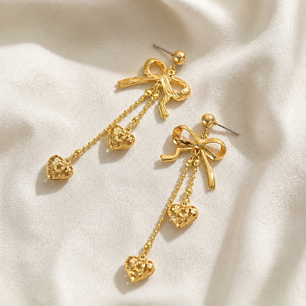 Bow Top Filigree Heart Drop Earrings in Gold Tone — main image