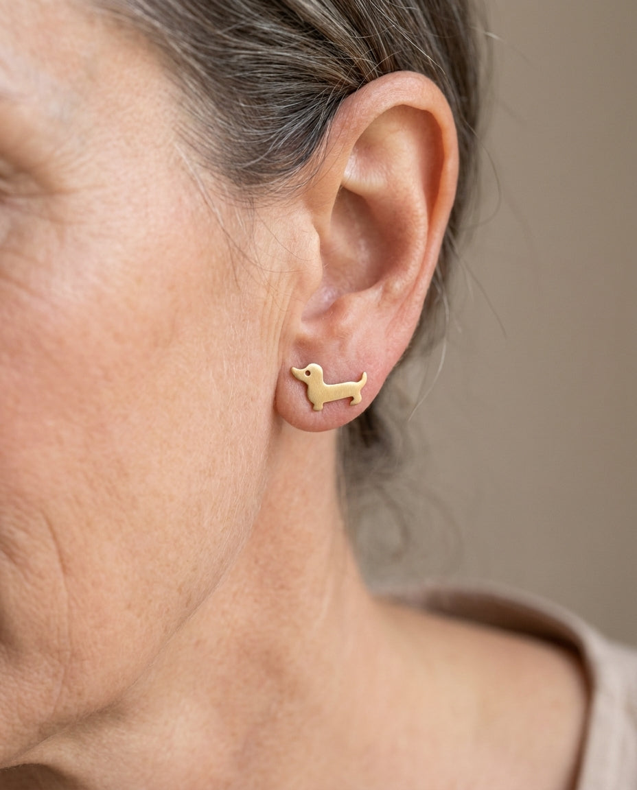 Estelle & Ruby Dachshund Stud Earrings, Sausage Dog Design, Alloy, Gold & Silver (AI-generated lifestyle image)